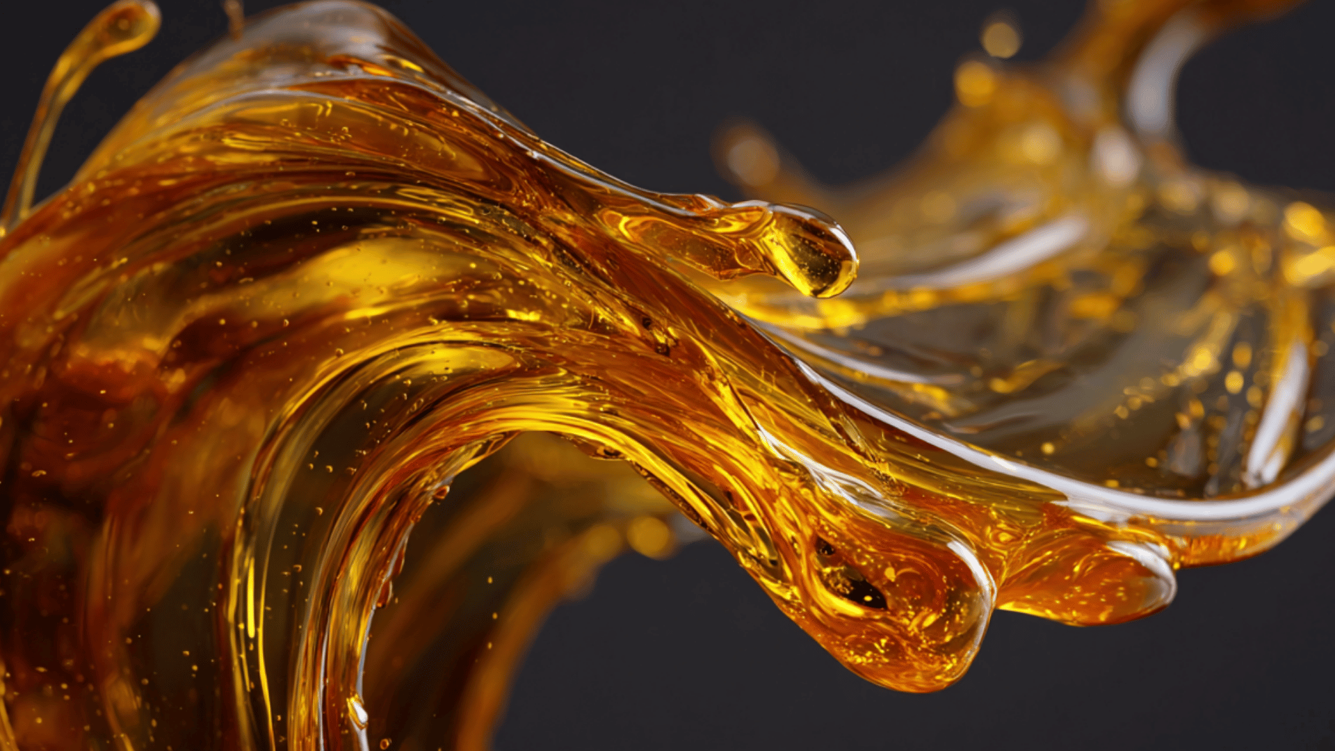 Golden engine oil swirling in motion