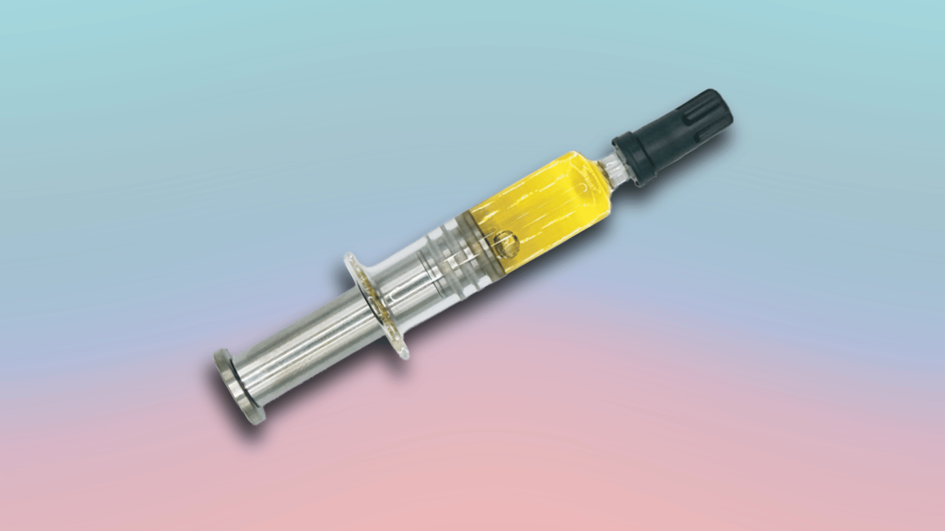 CBD oil syringe with yellow concentrate