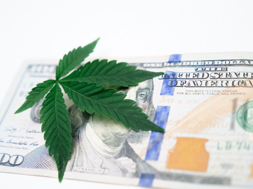 Marijuana leaf on a hundred dollar bill