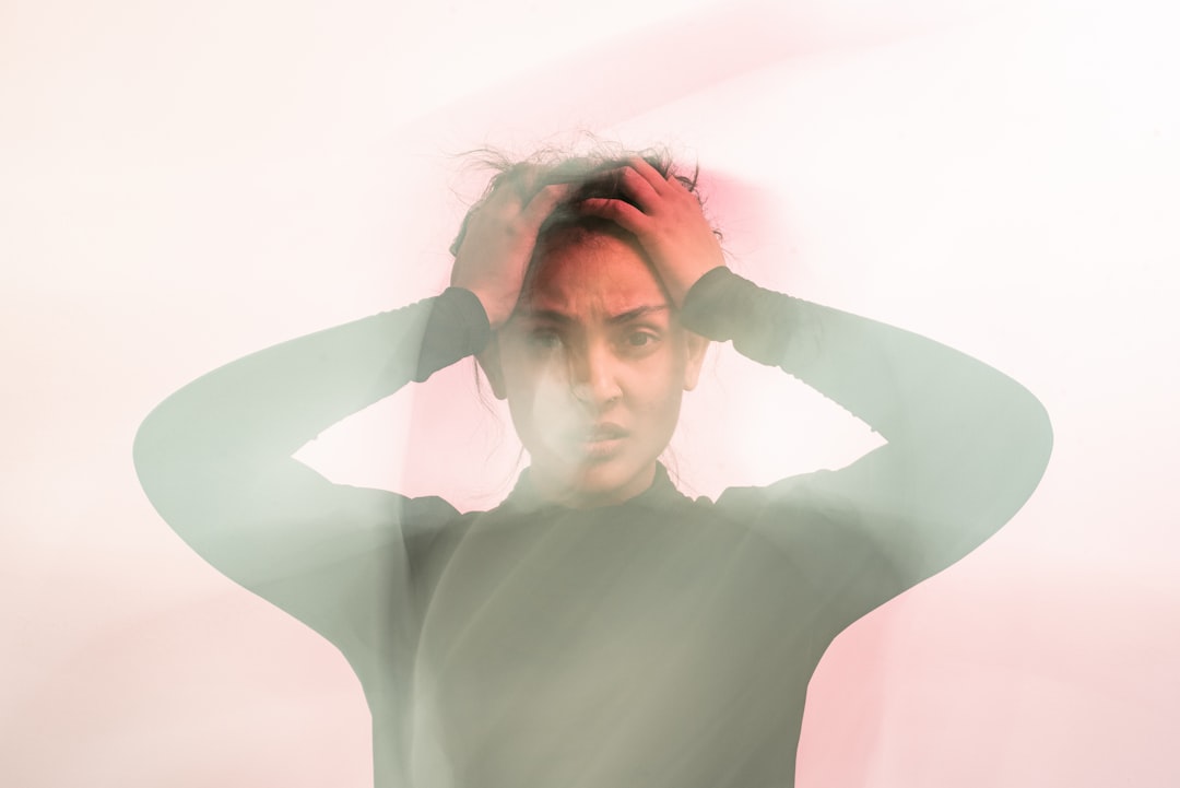 Stressed woman holding head anxiety concept